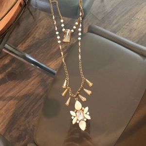 Long chain gold and cream necklace